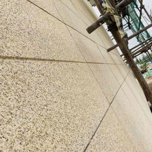 三门峡 黄金麻花岗岩荔枝面外墙干挂石材效果示例