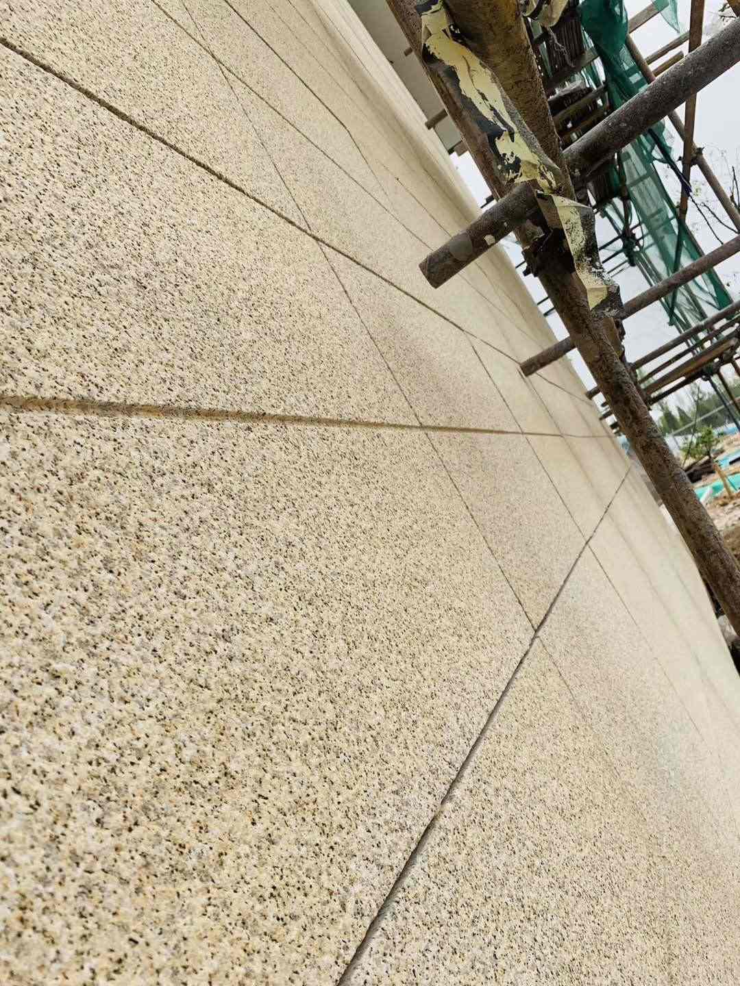 三门峡 黄金麻花岗岩荔枝面外墙干挂石材效果示例